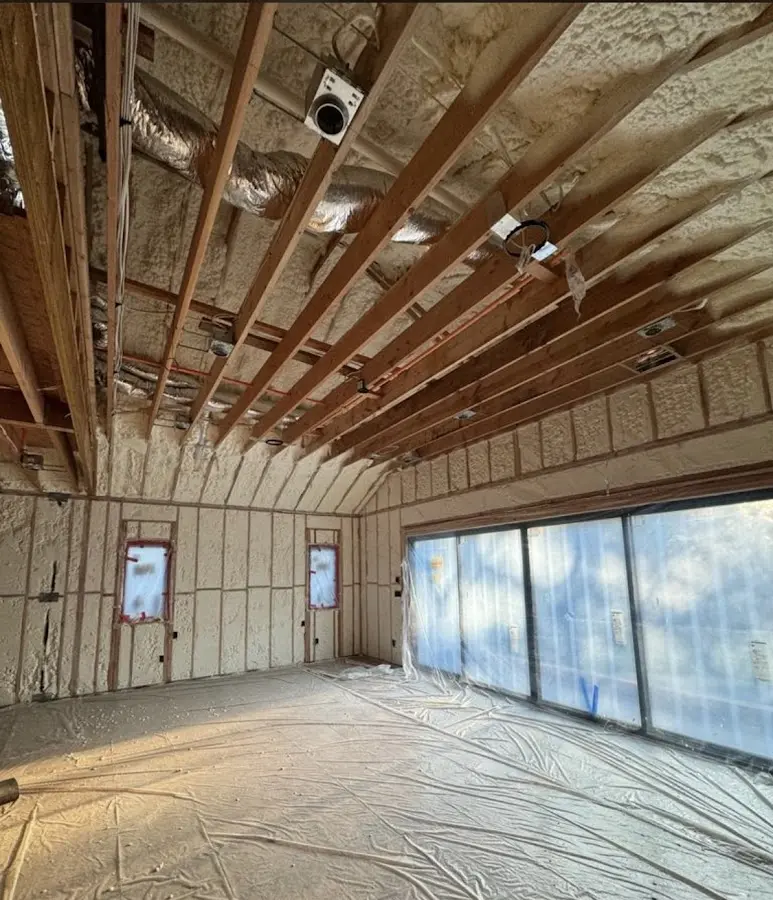 Interior walls and ceiling insulated with spray foam during new construction in Leawood